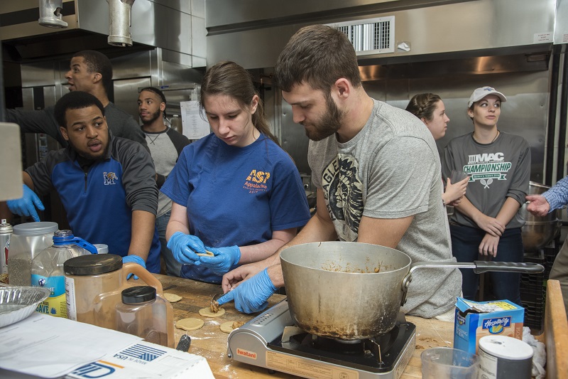 Lycoming College students prepare their final feast in the “Medieval Food and Culture” course, Spring 2017