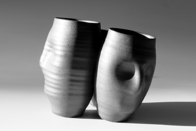 The Ties That Bind, joined trio of face vases, stoneware with black crystalline glaze,  © Katherine Sterngold