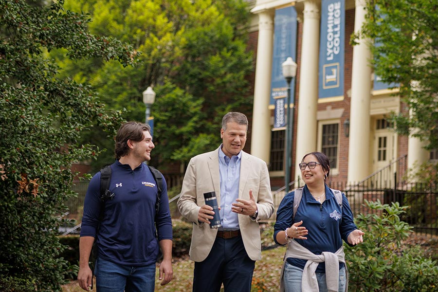 President Edmonds walking with students