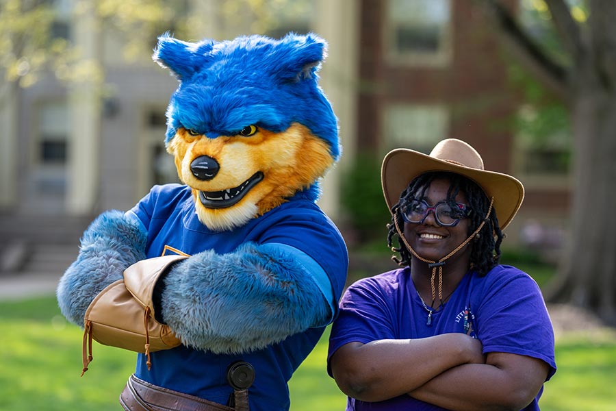 Lycoming's mascot, Lycos, with a student