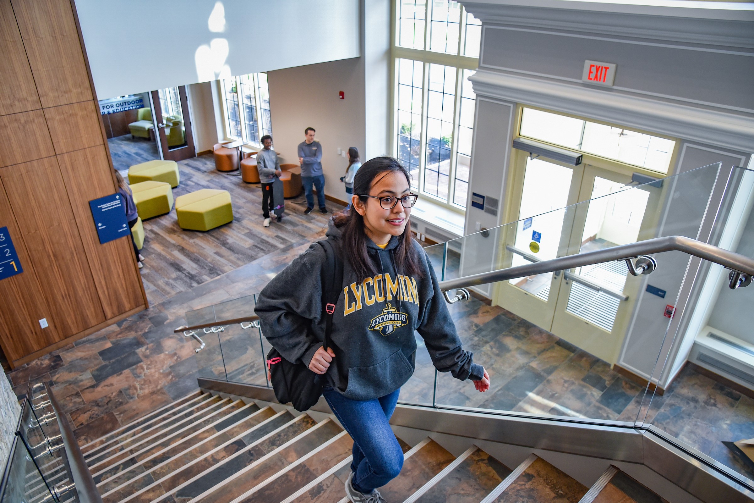 Student walking up stairs