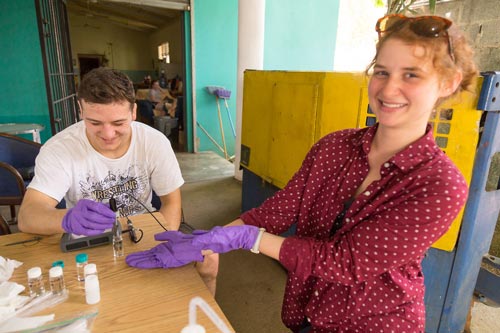 Brandon Conrad and Lizzie Ritter analyzing water in the Dominican Republic