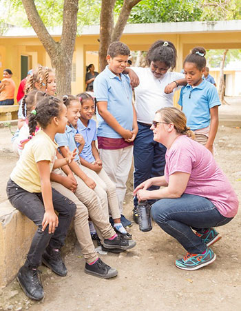 Education faculty member Rachel Hickoff-Cresko talks to school children in Peralta