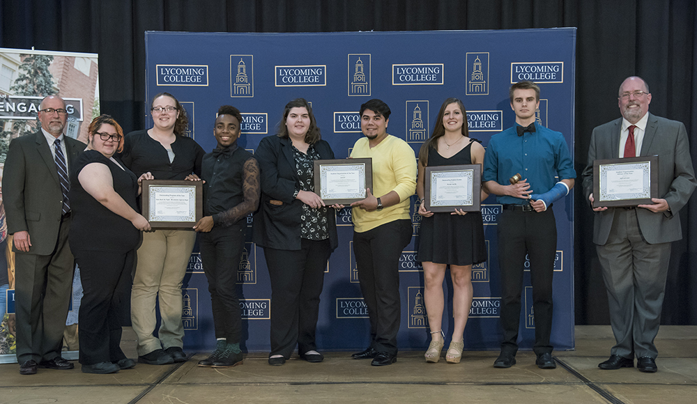 Student Programs Awards (L to R): Dr. Dan Miller; Kianna Pizarro, Samanntha Poole and Nigel Barnes for Revolution Against Rape; Jessica Hoff and Brandan Gracia for LACES; Nicole Calella for Outstanding Leader; Michael Panczyszyn is the incoming Student Senate president; and Rev. Jeff LeCrone.