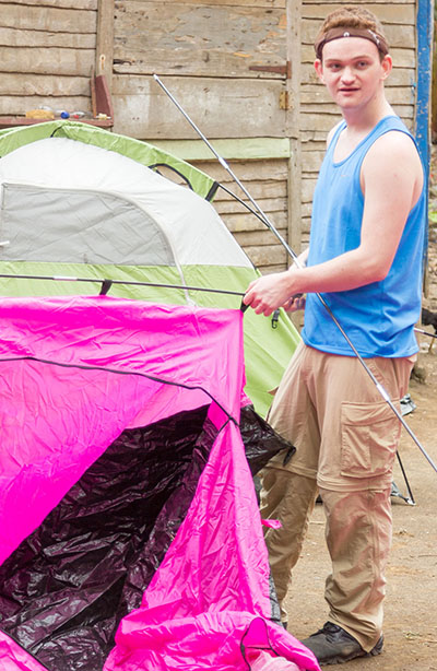 Spencer Vause assembles his tent that he will sleep in while in El Naranjito.