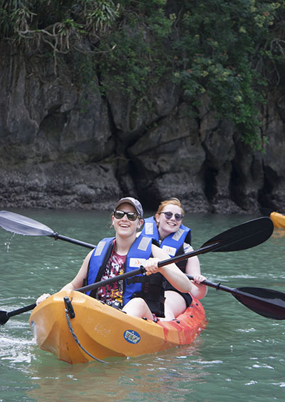 Students Erin Briggs and Tracy Robinson kayaking on HaLong Bay.
